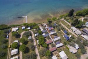 an aerial view of a group of houses by the water at Bungalov A in Sveti Filip i Jakov