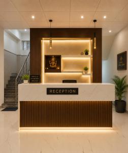 a reception area in a lobby with a reception desk at Landmark Hotel in Jodhpur +4 photos