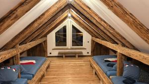 a room with two beds in a attic at Kachlówka in Lachowice