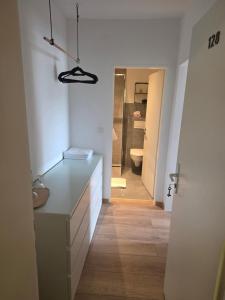 a bathroom with a sink and a toilet in a room at Hotel zur Post in Lüdinghausen