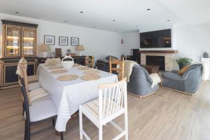 a living room with a table and chairs and a fireplace at El Rincón de Julia in Carrión de los Condes