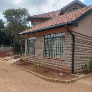 a building with windows on the side of it at HARMONY GUEST house in Nairobi