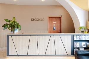 a reception counter at a hospital with a waiting room at Sándor Hotel in Pécs +35 photos