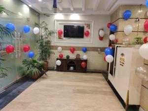 a room with red and blue balloons on the wall at Swiss Pearl Hotel Lahore in Lahore