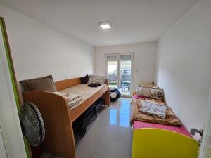 a room with a bed and a couch in it at Beogradski mir in Belgrade