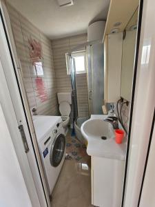 a small bathroom with a sink and a toilet at Beogradski mir in Belgrade