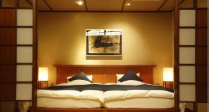 a bedroom with a large bed in a room at The hideout peaks in Bhīm Tāl