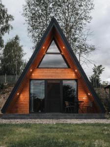 a small house with a triangular roof at The hideout peaks in Bhīm Tāl