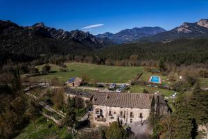an aerial view of an old house in the mountains at Les Eres de Guardiolans in Vilada +22 photos