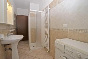 a bathroom with a sink and a toilet and a shower at Smith 3B in Lido degli Estensi