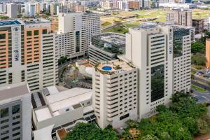 an overhead view of a city with tall buildings at Hotel Brasil 21 Suites, Affiliated by Meliá in Brasília