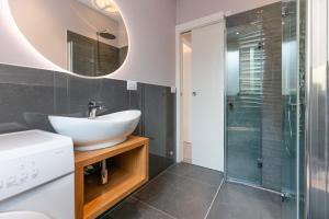 a bathroom with a sink and a shower at VILLA TASSO 25 BILO in Lido degli Estensi +47 photos