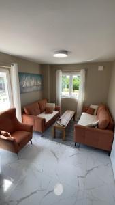 a living room with two couches and a table at Villa Smokva in Smoković