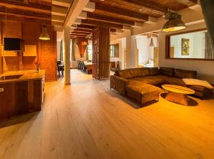 a living room with a couch and a table at Wauermühle in Lohmen
