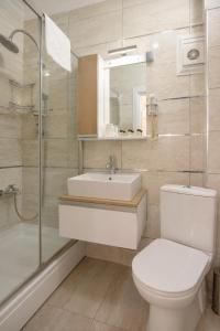 a bathroom with a toilet and a sink and a shower at Genius Hotel Istanbul in Istanbul +35 photos