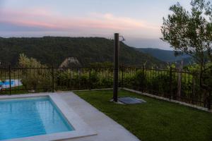 a swimming pool with a view of the mountains at Villa Lea Marezige Heated Pool near Koper in Marezige