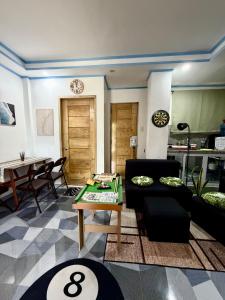 a living room with a couch and a table at Beachside Room with Bathroom San Juan ELYU in San Juan +28 photos