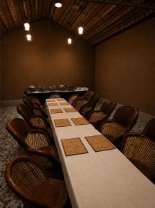 a conference room with a long table and chairs at Urban Dhani in Gurgaon