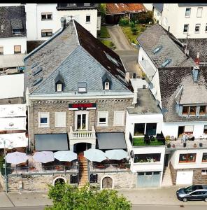 an aerial view of a building with umbrellas at Casa del Mondo 2 in Sankt Aldegund +3 photos