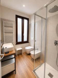 a bathroom with a toilet and a sink and a shower at Palazzo dei Guardiani in Venice +27 photos