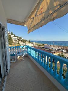 a balcony with a view of the ocean at Yamas Hotel "Ex Malibu" in Dhërmi