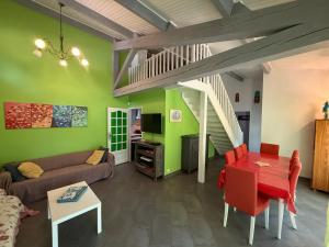 a living room with a couch and a table at Villa La Marpierre in Mondragon