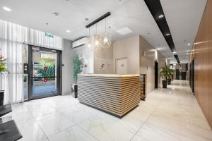 a lobby with a reception desk in a building at Mr Elifelet View with a Pool Neve Tsedek in Mashabbe Sade +111 photos