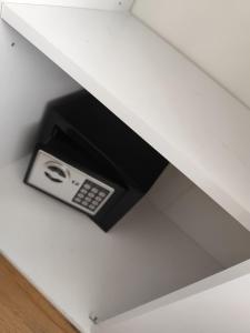 a cell phone sticking out of a drawer at Appartement in Hannover