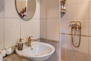 a bathroom with a sink and a mirror at Holiday House Rea with BBQ and two terrace in Sveti Donat +90 photos