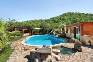 a swimming pool in a yard with a house at Villa Aresini - Dimora Esclusiva in Montemiletto