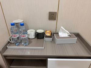 two bottles of water sitting on top of a counter at Zarya in Ölgiy
