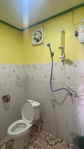 a bathroom with a toilet and a shower at Sompong Sunset View Guesthouse in Don Det +26 photos