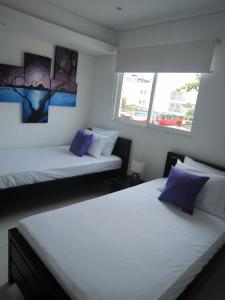 Postel nebo postele na pokoji v ubytování Hotel Valmar