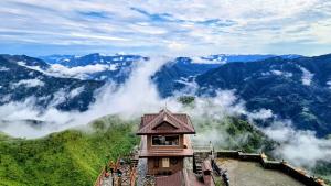 a building on top of a mountain in the mountains at Kali Tibba Resort Chail in Chail