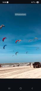 a group of kites flying in the sky on a beach at Yahweh Guriú Kite in Guriú