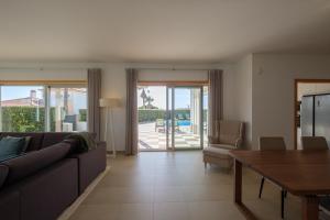 a living room with a couch and a table at Marvellous Villa in Óbidos