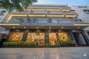 a facade of a building with a balcony at Hotel Peridot with Free Airport Pickup in New Delhi