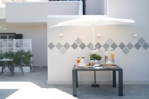 a table with food on it in a room with a wall at Grania Le Radici - Agriresort in Gragnano