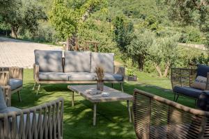 a couch and two chairs and a table at Grania Le Radici - Agriresort in Gragnano +21 photos