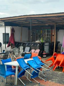a group of chairs and tables in a yard at whitestone palace hotel in Eggan