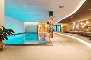 a swimming pool in the middle of a building at Terravita in Fiss