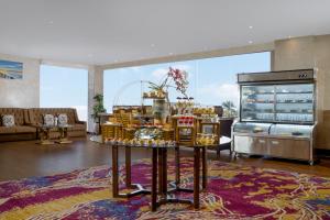 a living room with a table with items on it at Zenith Sunshine in Lebakwangi