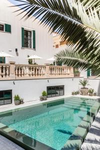 a swimming pool in the middle of a building at Concepcio by Nobis, Palma, a Member of Design Hotels in Palma de Mallorca