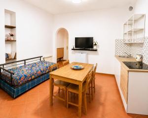 a living room with a table and a couch at Bella Maratea in Maratea