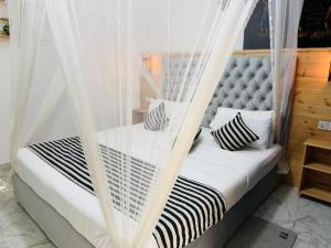 a bedroom with a bed with mosquito nets at Mount Breeze Ella in Ella +73 photos