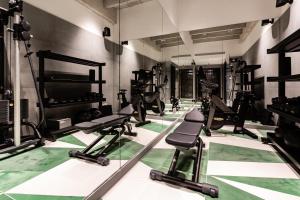 a gym with several treadmills and machines at Concepcio by Nobis, Palma, a Member of Design Hotels in Palma de Mallorca