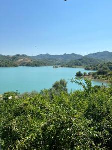 a view of a lake with mountains in the background at Lake Breeze in Gjokaj