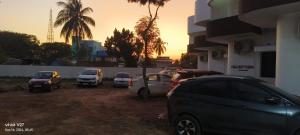 a group of cars parked next to a building at Hotel Tamilnadu-Unit 2 in Rāmeswaram +12 photos