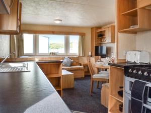 a kitchen and living room of a caravan at The Getaway - Uk49617 in Lancaster
