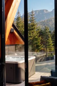 a view of a hot tub from a window at come home - bespoke villa in Kościelisko